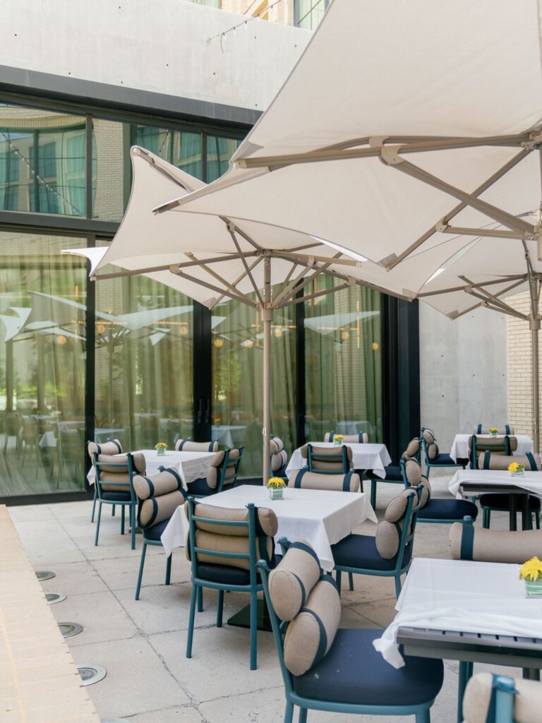 Patio seating at Emilia's restaurant at The Crescent Fort Worth